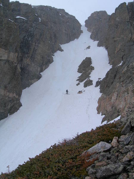 A skier descends Chaos Couloir.