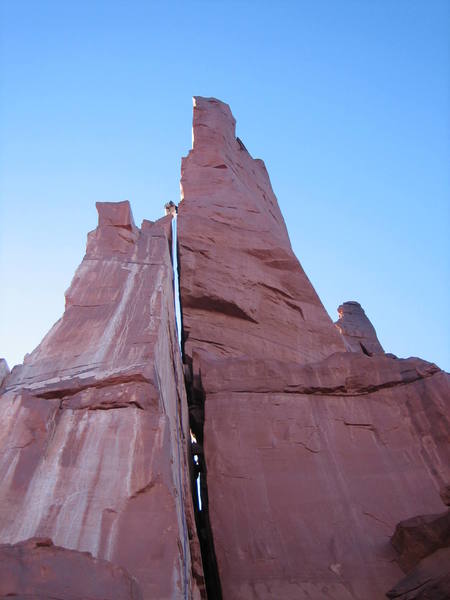 Optional rap route. From the top of the Sister Squeeze flake/pillar you can rap off to the right and hit the ground with one 60m rope. This seemed to be a cleaner rap option then going off the belay anchors on top of P2.