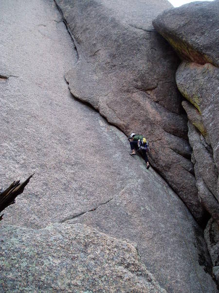 Luke laybacking and jamming on the lower angle start. There are lots of knobs for your feet.