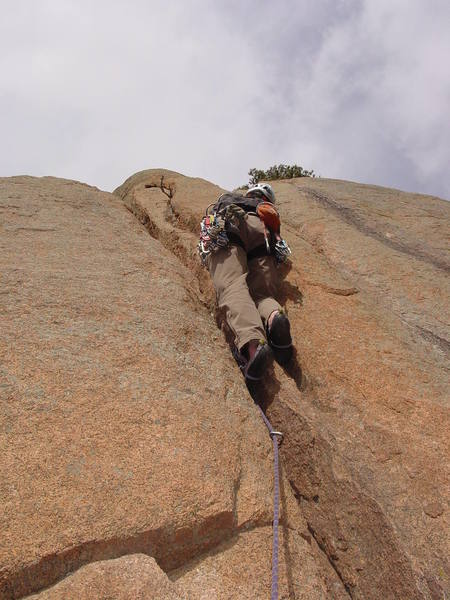 A crack on the right helps you get past a narrowing of the main crack.<br>
<br>
Photo by Paul Rezucha.