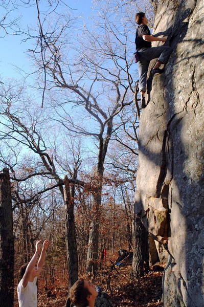 Kelsen trying to figure out the top of it without falling off. Little holds are up there.