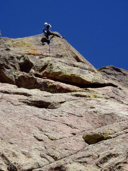 Greg likes to hang out like this on steep rock after hard moves. This time it's off a heel hook.