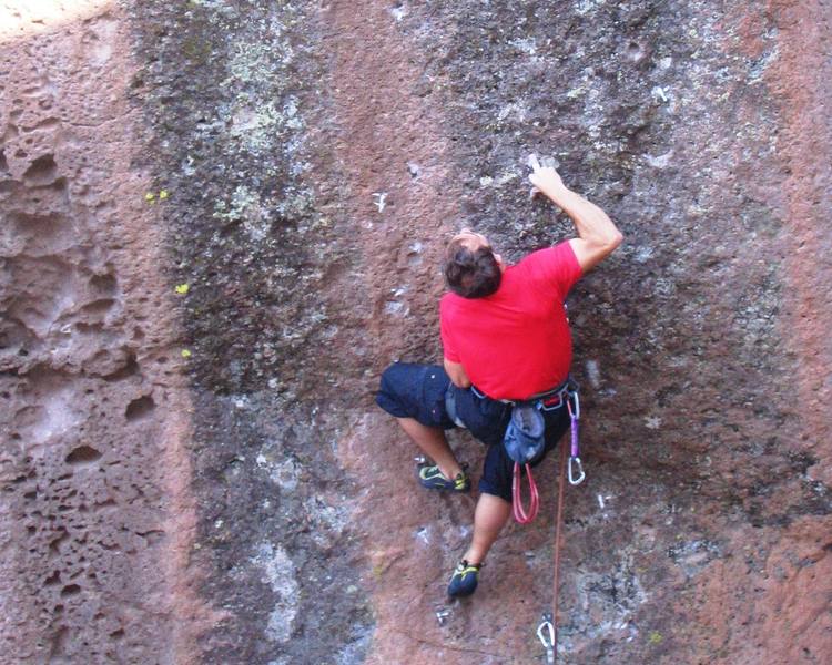 More posing at the 3rd bolt. The right hand is in the 2nd mono, just below the crux. The next move is a long crank to a super tweaky 2-finger pocket at the very top-center of the pic. The crux is moving off of that 2-finger pocket.