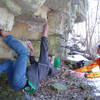 Mike climbing 'Calm Like a Bomb' in freezing weather. 