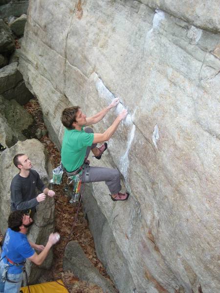 Getting set up for the boulder problem on The Sting, which is a big lunge to the next horizontal. Photo Kayte Knower.