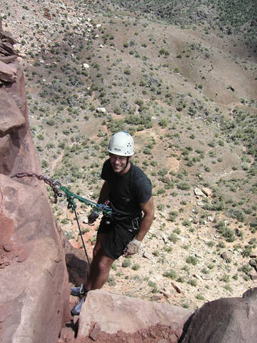 Tony At the last Belay of Desert Solitaire (5.11, III, Colorado National Monument). Photo by Bill Wright, 2005