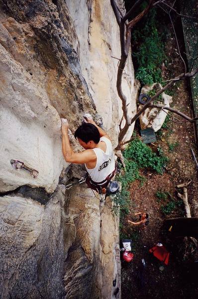 Kenny Low in a gaston on a 6b at Nanyang Wall, in the Batu Caves area of K.L., Malaysia. Photo by Tony Bubb, 12/06.