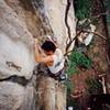 Kenny Low in a gaston on a 6b at Nanyang Wall, in the Batu Caves area of K.L., Malaysia. Photo by Tony Bubb, 12/06.