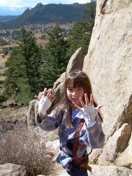 Teaching 'em how to climb crack on Knee Catcher, a crack that was a challenge in blowing snow last season. Jaclyn, 8. TR no falls.