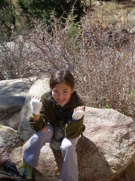 Teaching 'em how to climb crack on Knee Catcher, a crack that was a challenge in blowing snow last season. Kira, 10.