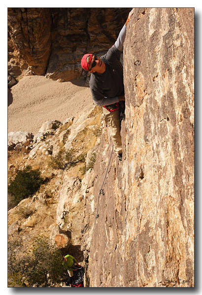 Mark leading "Solitary". Stacy is taking photo girth-hitched to the chains of the neighboring route "Birdman".