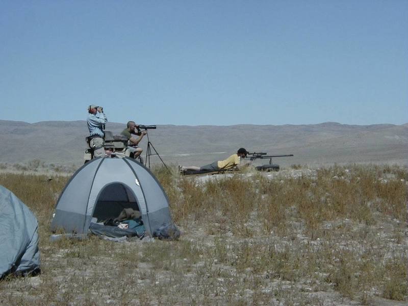 My friends and I dialing in on a coffee can at 1,000 yards with my .50 BMG shoulder fired canon. Tule Hardpan, Ibex, UT. Note that Virgil (holding binoculars) is still wearing his harness. In addition to pulverising several targets out to 1 mile, we established 11 new routes on this trip.
