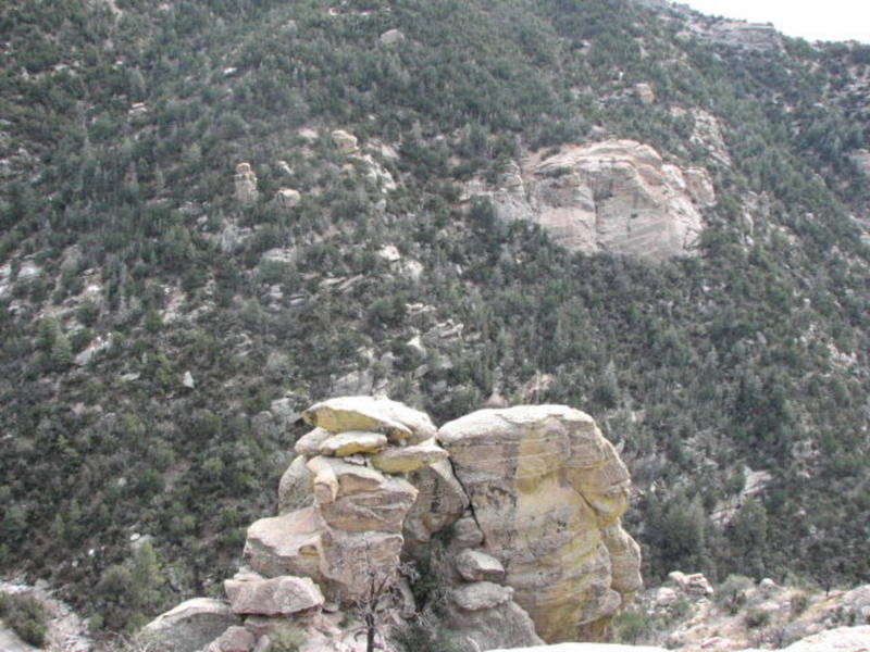 The top of "wailing wall" viewed from the approach trail with "Friction Rock" in the background. 