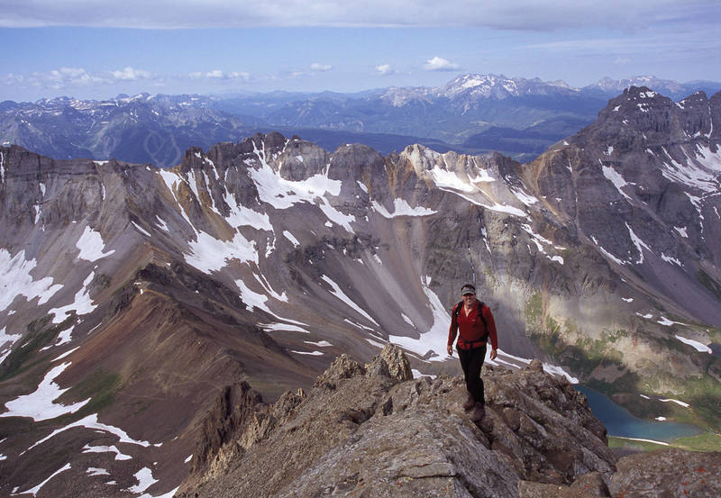 Doug Wall nearing the top of the Southwest Ridge.<br>
<br>
Telluride Ski Area, Lizard Head Peak, and the Wilson group are visible in the background.