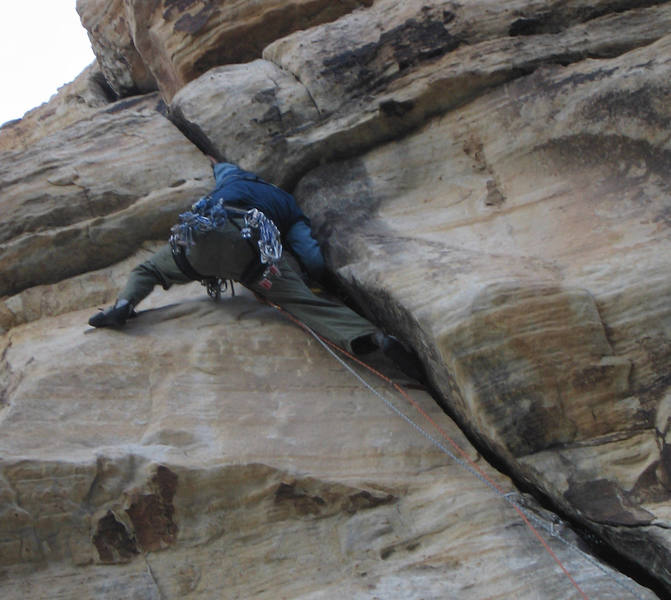 Brett cruxes on Karate Crack. Photo by Allart.