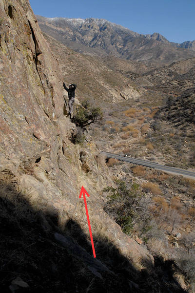 This photo shows the traverse from the base of PIH and Capitalism & Freedom to the top of the first pitch of Free to Choose. Romain is standing very near the P1 anchor on Free to Choose.<br>
<br>
Using the first pitch of Free to Choose to approach and descend from PIH and other routes is preferable to the using the loose Class 3 gully.