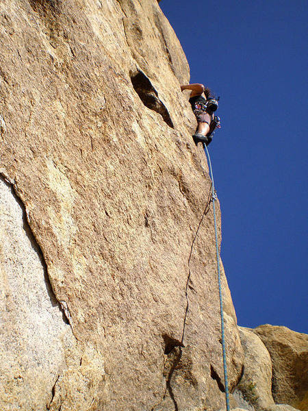 Susan at the 2nd bolt heading towards the crux