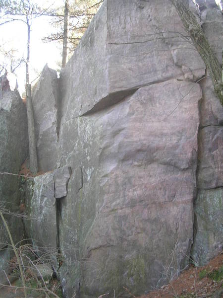Sex & Chocolate ascends using the arete and crimps on the face to dyno to the "slopey" break.