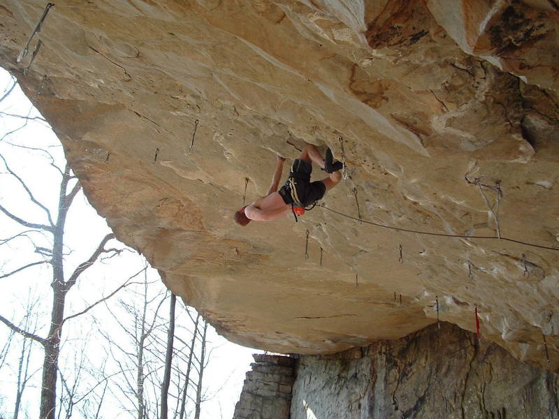 technical rock climbing with saftey rope, hardware and sticky rubber shoes