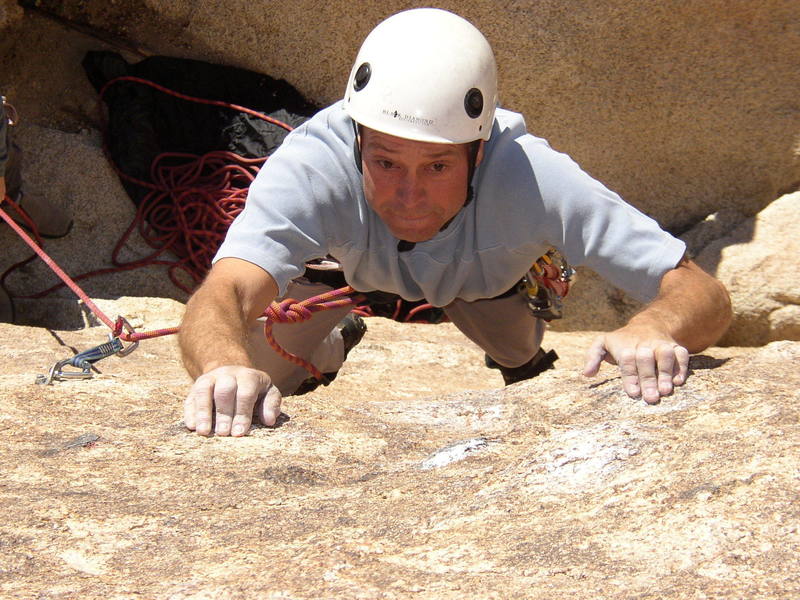 Larry going for the crux after cliping the first bolt.