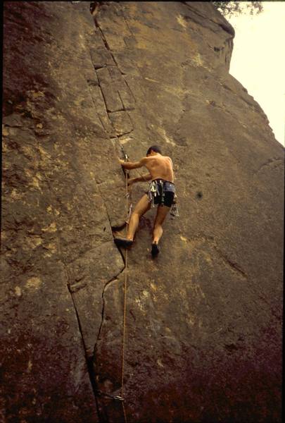 Tony Bubb a little higher on "Supercrack" (5.12-) at Singapore's Dairy Farm climbing area. Photo by Lois Tan, 3/2005.