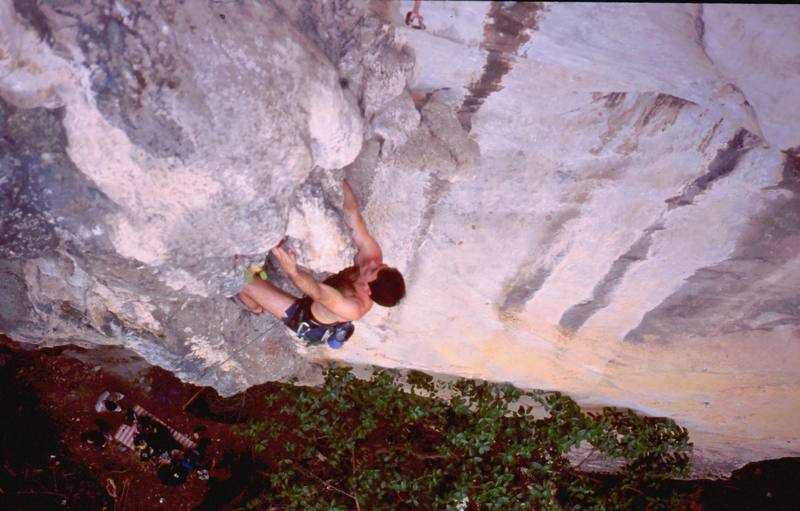 Tony starting up 'For a Few Hangers More (5.10)' on the Nanyang Wall of Batu Caves, in K.L., Malaysia. Photo by Kenny Low, 2005.