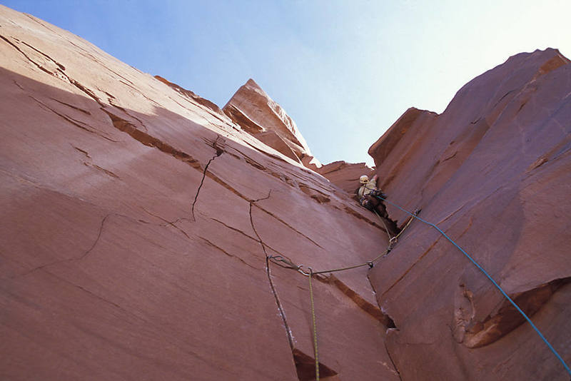 Exiting the squeeze chimney on pitch two.