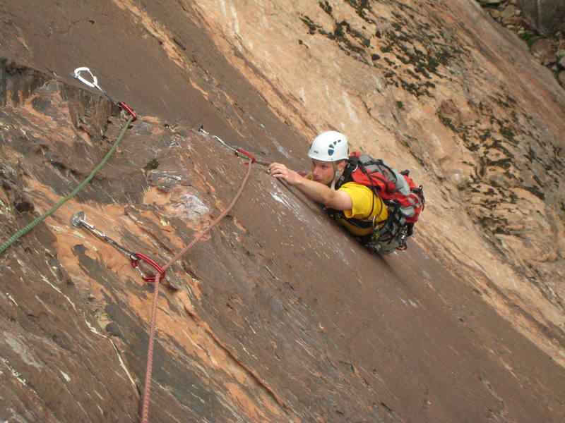 (Damn that focal point!) Bill Geist making the moves through the crux on the second pitch. Great crack through a smooth, beautiful face. April 7, 2007.
