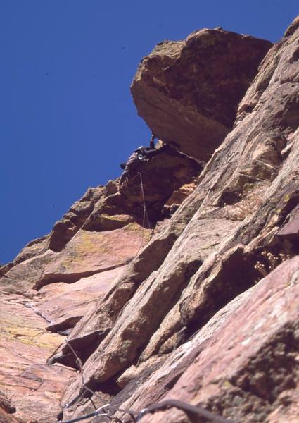 Tony Bubb sews it up on the RastaMan Roof variation (5.9+) of Reggae, on the Wind Tower of Eldo. Photo by Joseffa Meir, 2002.