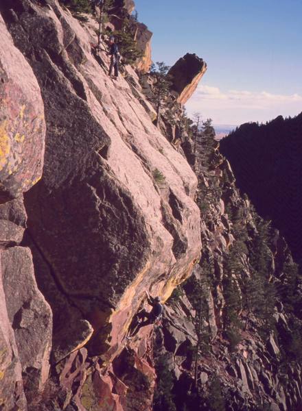 Unknown climbers atop of and following on 'Whiplash (5.10c)' on Eldo's West Ridge. Photo by Tony Bubb, 2003.