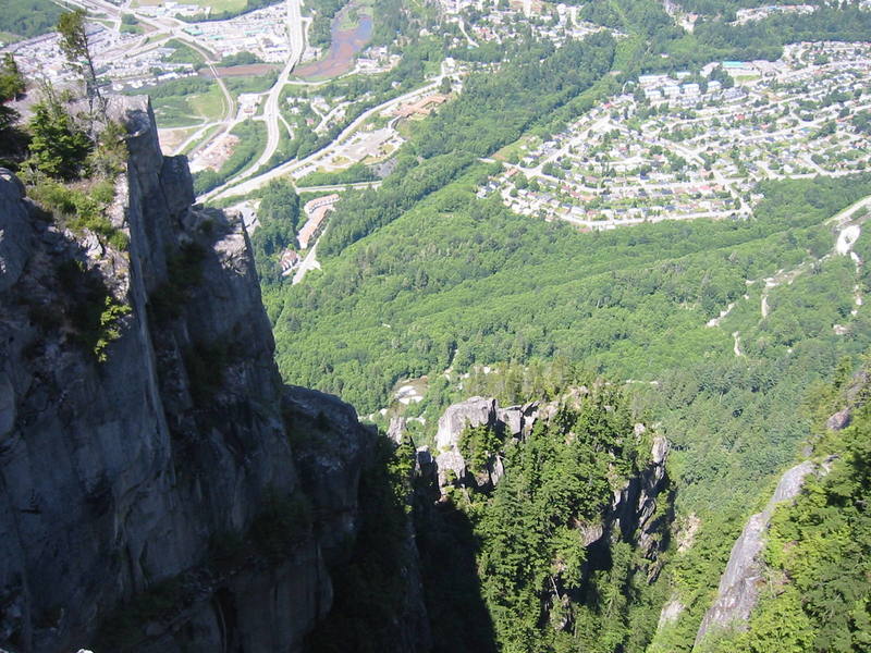 Looking down the North Gully of the Chief. The Acrophobe towers are visible in the lower middle of the shot. The finishing pitches are just around the corner of the buttress on the right. The building in the upper middle with the brown roof is the hospital. The Smoke Bluffs are just out of sight at the top of the image.