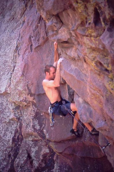 Shane Zentner approaching the crux of 'M' on the Whale's Tail in Eldo.  Photo by Tony Bubb, 2004.