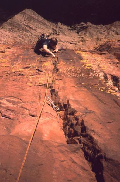 Dave Stewart in the crux on P2 of 'Three Old Farts Young At Heart (5.10)' on Eldo's Redgarden Wall. Photo by Tony Bubb, 2004.
