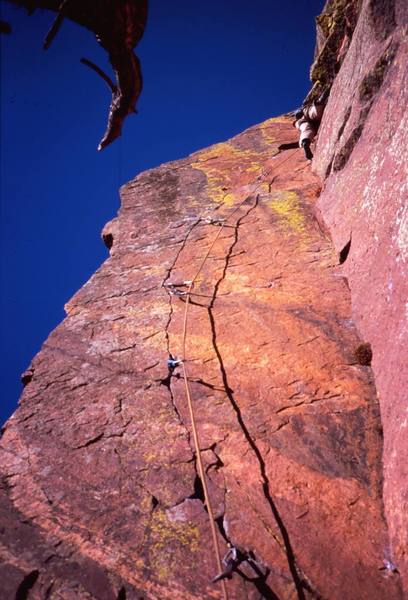 Josh Janes a little higher and into the tough stemming on 'Pony Express (11c)', on Eldo's West Ridge. Photo by Tony Bubb, 2005.