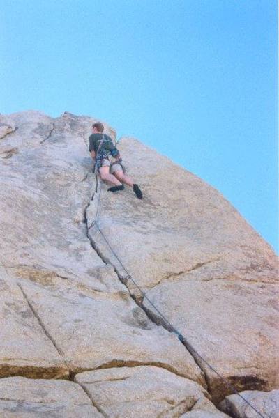 Chris nearing the top of Sail Away 5.8-