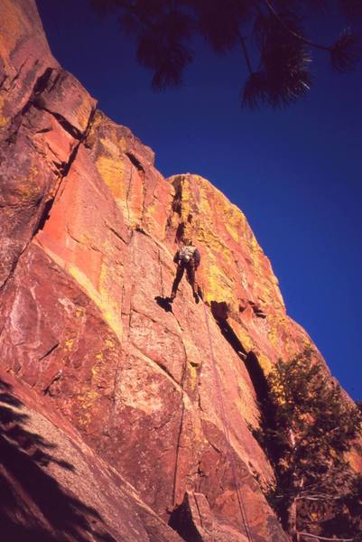 Jason Haas descends via the raps on 'Sooberb' on Eldo's West Ridge. The area glows with color at sunset. Photo by Tony Bubb, 2/2007.