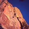 Jason Haas descends via the raps on 'Sooberb' on Eldo's West Ridge. The area glows with color at sunset. Photo by Tony Bubb, 2/2007.
