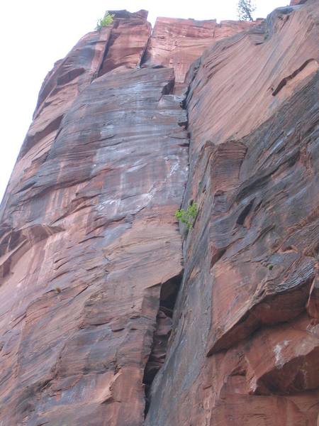 Looking up at the "Monkeyhouse". The offwidth pitch on the right and the Monkeyfinger crack on the left.