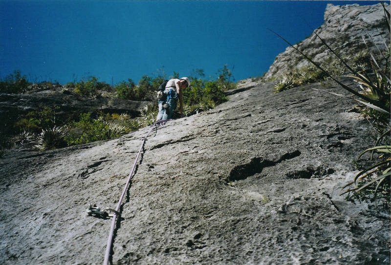 Me belaying my wife up the second pitch. Notice all of the prickly bushes - many a rope had been stuck in these by a careless climber!