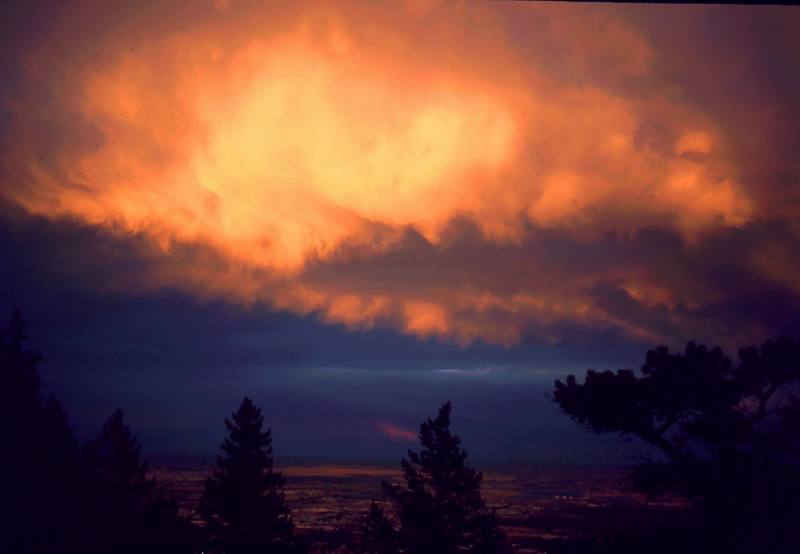 The Flatirons above Boulder offer some spectacular views of the city and the plains below at sunset. Photo by Tony Bubb, 2002.