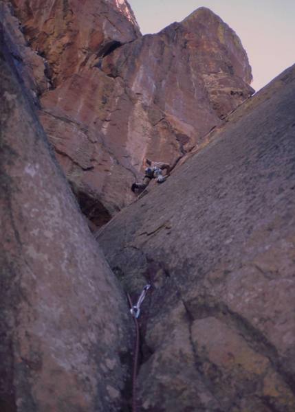 Tony Bubb up high on 'A Shadow Sickness (5.10a)' on the Fiddle Head of Fern Canyon in the Flatirons above Boulder. Picture by Chris Parks, 2004.
