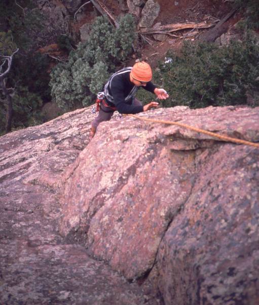 Chris Parks cleans the gear from the route on the 'NW Arete (5.8, S)' on the F.A. of that route on The Sibling. Photo by Tony Bubb.