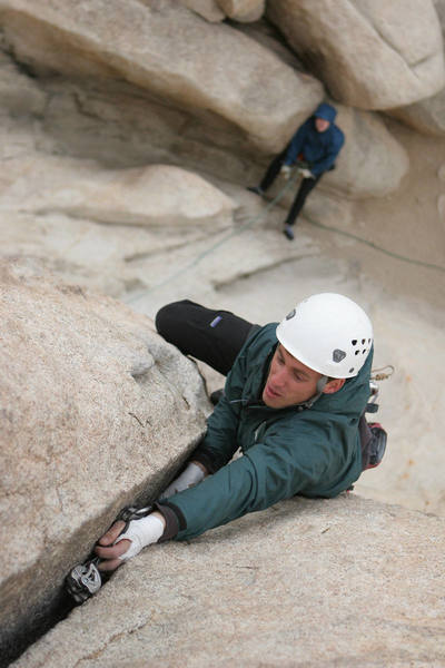 Matt slots a cam mid-crux on Double Cross.