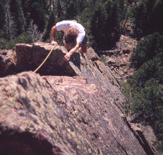 William McGehee close to the top of FA of 'Over The Rainbow (5.10b, S)' in Fern Canyon, in the Flatirons. If run onto the end of Rainbow Bridge, this makes the combined pitched into a nearly 200' 4-star affair, and one of the best in the area. Photo by Tony Bubb.