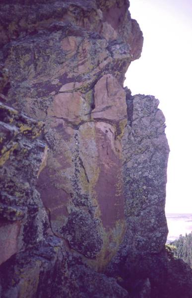 'One In The Chamber' ascends the corner just left of the nearest arete in this photo then continues up the face above.