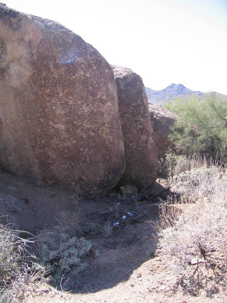 Right on the face of the boulder is microscopic down and to the left. My friend has already sent it, But give it a try, He thinks its a V8 or a V9. Up in the air, tell me what you think.