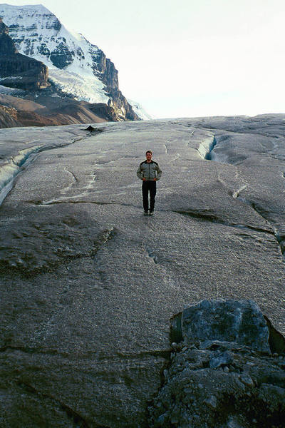 Standing on the Athabasca Glacier with Mt. Andromeda in the background, sometime in the fall of 2001.  The curving snow face is the very popular Skyladder route.