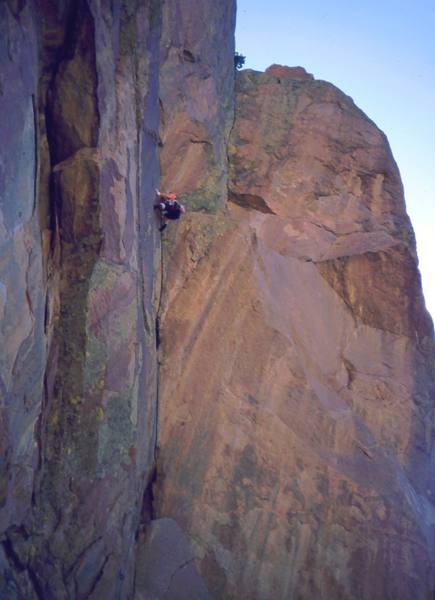 Sylvia Luebben about to get onto the crux ramp of "Nameless Demons (10b)" on Rock Of Ages, near Estes Park, CO. Photo by Tony Bubb, August 2002.