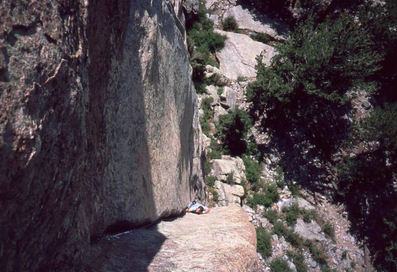 Josh Janes follows up on the insecure 'Bonzo (10b)' on Lumpy's Sundance Buttress. Photo by Tony Bubb, 2004.