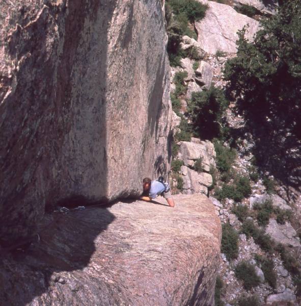 Josh Janes "faces" the middle crux of 'Bonzo (10b)' on Lumpy's Sundance Buttress. Photo by Tony Bubb, 2004.